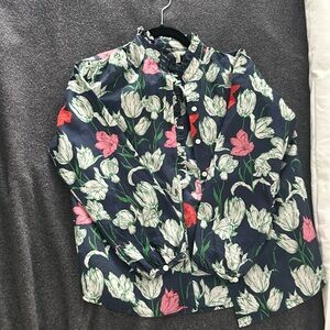 Trovata California button down with a floral print and ruffle detailing.